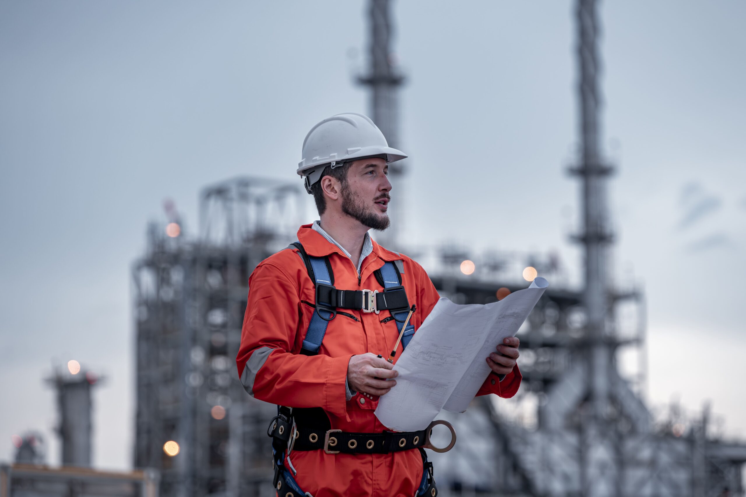 engineer-survey-team-wear-uniform-helmet-stand-workplace-checking-blueprint-project-radio-communication-min
